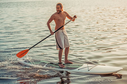 man on standup paddleboard California